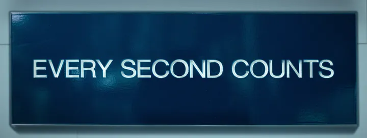 The “Every Second Counts” sign from The Bear: white capital letters on a dark blue panel with a grey frame