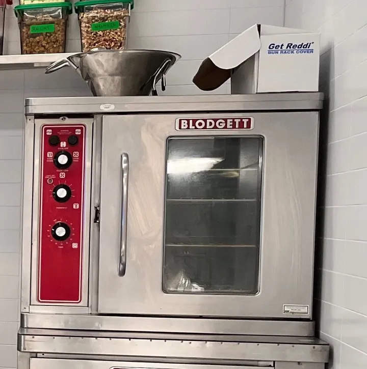 The Blodgett convection oven on set, with a steel bowl and a box on top