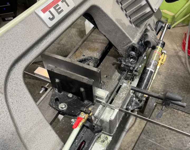 Steel bar clamped in a Jet horizontal band saw